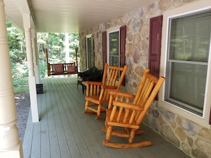 Enjoy your morning coffee on the front porch rockers or swing!