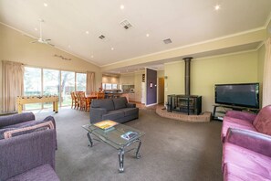 Large living area with cozy log fire