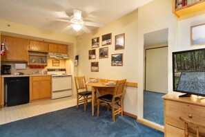View of kitchenette and dining space in the studio