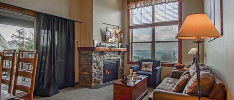 Living room with gas fireplace and queen sleeper sofa