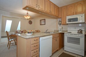 Well equipped kitchen with laundry