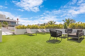 Relax in style and enjoy the best of Miami Beach living from the rooftop of 250 Collins Apartment.