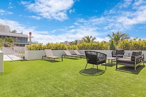 Relax in style and enjoy the best of Miami Beach living from the rooftop of 250 Collins Apartment.