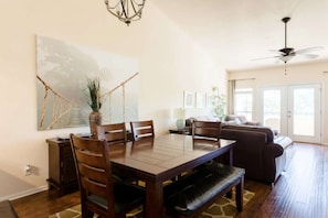 Open floor plan between kitchen, dining and living areas