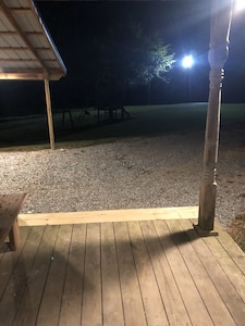 Cabin with 40 ft porch overlooking a pond. 