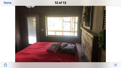 Cabin with 40 ft porch overlooking a pond. 