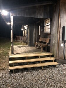 Cabin with 40 ft porch overlooking a pond. 