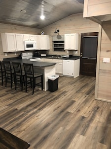 Cabin with 40 ft porch overlooking a pond. 