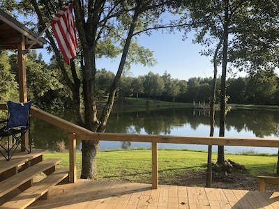 Cabin with 40 ft porch overlooking a pond. 