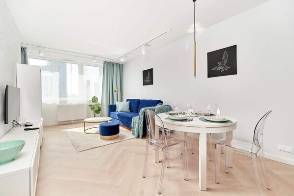 Living room with a comfortable sofa and TV. 