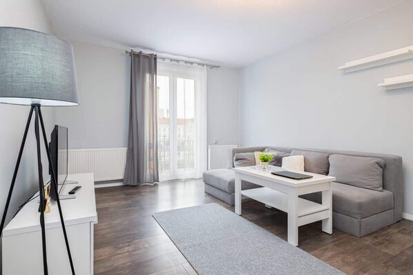 Living room with a comfortable sofa and TV. 