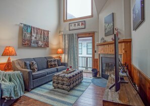 View of living room with door way to the balcony