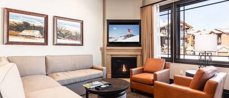 Living Room ~ Gas Fireplace -Sleeper sofa sectional, leather club chairs, and Bluetooth stereo.