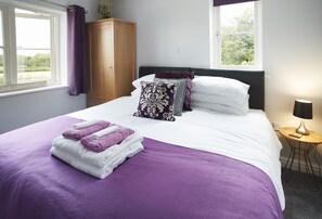 Ground floor: The master bedroom with 6' zip and link bed which can be configured as two 3' singles on request