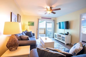 Enjoy the sounds of the ocean in this spacious, comfortable living room with recently updated flooring.