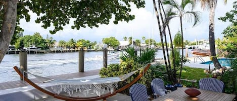 Outdoor dining table overlooking the water. 