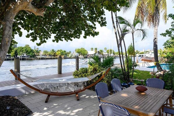 Outdoor dining table overlooking the water. 