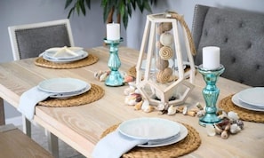 Cozy beach theme dining up to 6 guests .