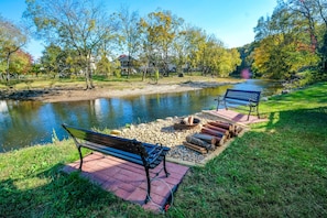 River Cabin Pigeon Forge "River Livin" - Outdoor Fire Pit and Benches located next to the Little Pigeon River