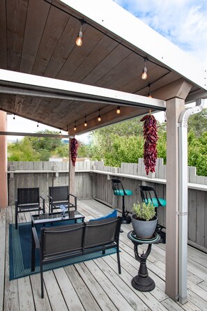 Lighted 2nd level deck with tree top views.