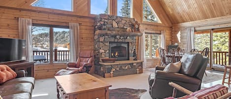 Two story sun drenched great room with spectacular views