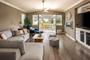 Step out of the living room and into open-air balcony offering views of the sea.