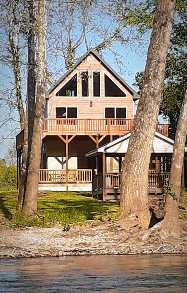 View of our beautiful cabin from the middle of the river