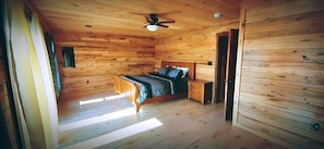 Master bedroom w King bed & sliding glass door that opens to wrap around deck