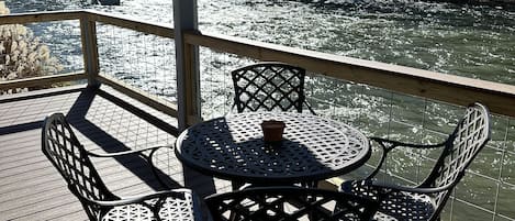 Covered porch right on the South Holston River! 