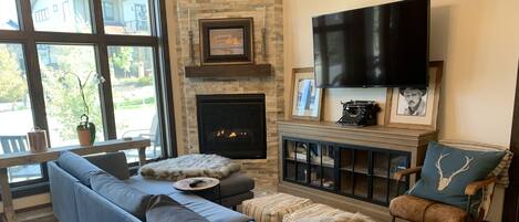 Robert Redford photos, gas fireplace, floor to ceilings windows, 55” SmartTV