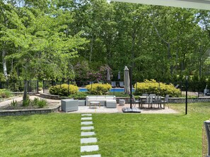 Backyard with fenced-in heated pool 