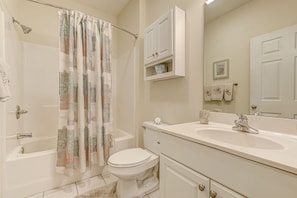 Master bath en-suite shower-tub combo curved shower curtain for more elbow room
