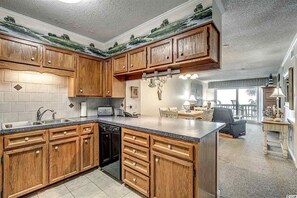 Kitchen opens to dining and living area