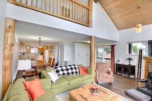 Living space with timber beams and loft.