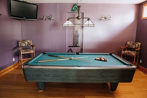 Full size pool table with tv so you can play while catching the game