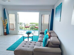 Spacious living room area with view of the Ocean