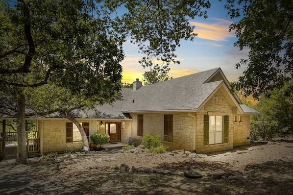 The landscaping and construction of the Guadalupe River Retreat make it look right at home in its riverside setting.