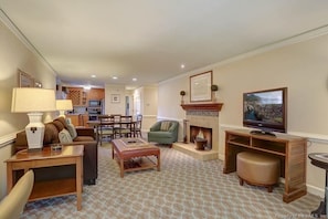 Open-concept main living area with wood-burning fireplace