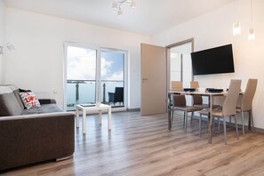Living room of Pięć Mórz Lotnicza 1I/20 apartment with sofa