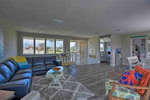 Front Entrance | Leather Sofa | Ocean-Themed Accents