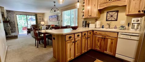 Entry view kitchen and living room