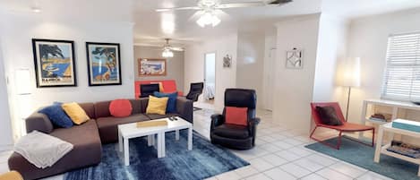 Cute living room space with very comfy sofa and leather recliner.