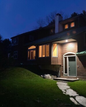 Front of house at night. 