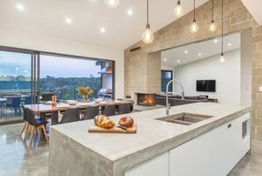 Whip up a storm in the designer kitchen with a breakfast bar and top-notch appliances.