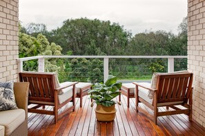 Unwind with a glass of wine on the balcony, surrounded by serene Peppermint trees and coastal breezes.