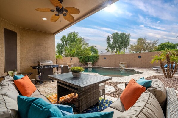 This home has it all!  Plenty of outdoor seating and a sparkling HEATED swimming pool!