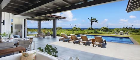 Outdoor living space and pool with ocean views