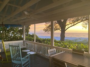 Porch boasts a swing, rocking chairs and even a table for dining.