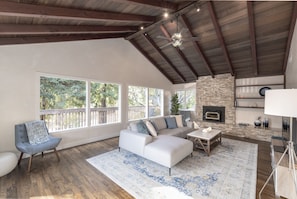 Upper Floor Living Room with Wood-Burning Fireplace