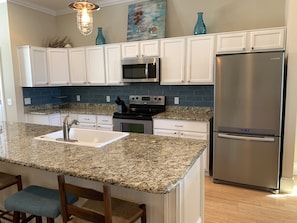 Kitchen with granite counter island